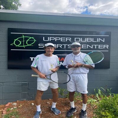 Dr. Marshall Hubsher holding Upper Dublin Men's 70+ championship trophy